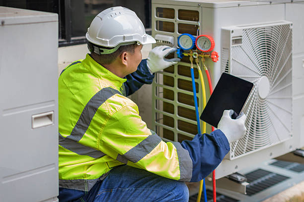 Professional Heat Pump Repair technician working in Magnolia, TX